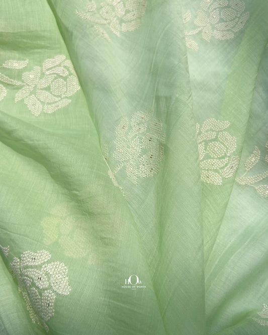 Pure green Mul Chanderi fabric with embroidery for suits and sarees – Banarasi-style handloom textile.