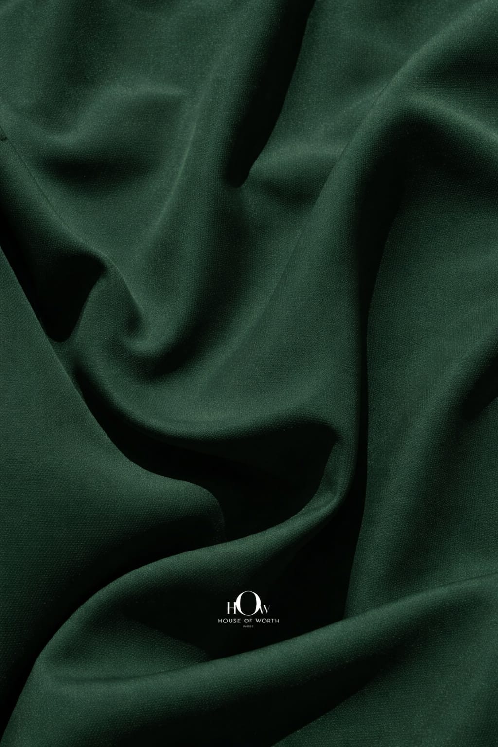 Close-up bottle green banana crepe texture, premium heavy crepe material for suits and blazers
