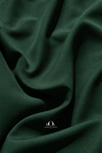 Close-up bottle green banana crepe texture, premium heavy crepe material for suits and blazers
