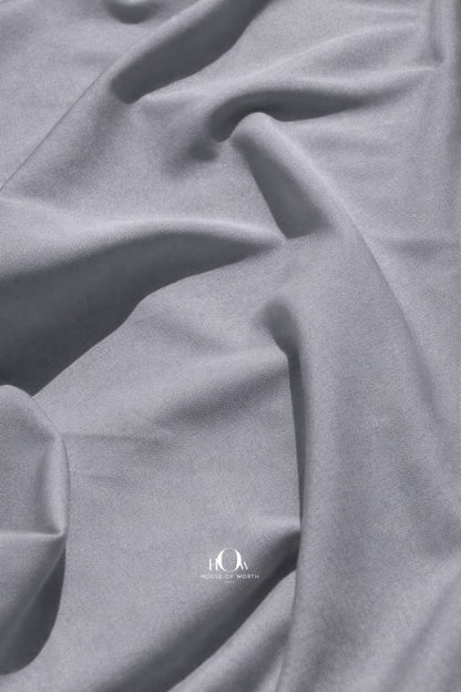 Grey banana crepe fabric close-up showing soft heavy crepe texture for blazers and trousers