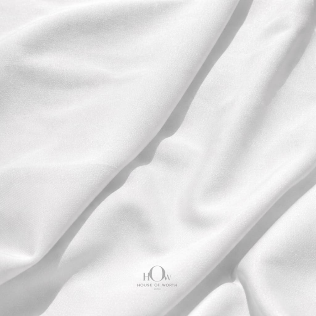 Close-up of white banana crepe fabric texture, premium heavy crepe material for tailoring