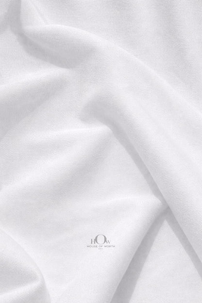 White banana crepe fabric drape on mannequin for western wear suits and designer outfits