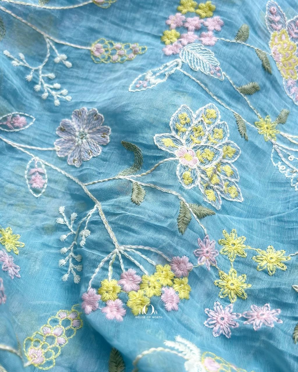 Lightweight sheer Chanderi fabric in silk-cotton mix with artistic floral designs