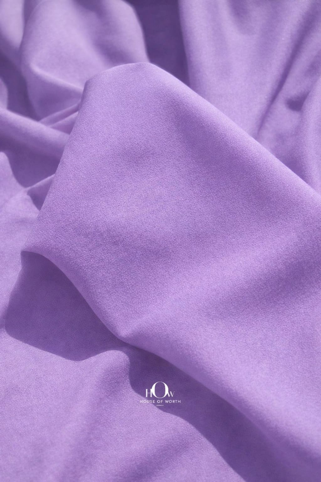 Lilac imported banana crepe fabric with smooth finish for western wear dresses and skirts