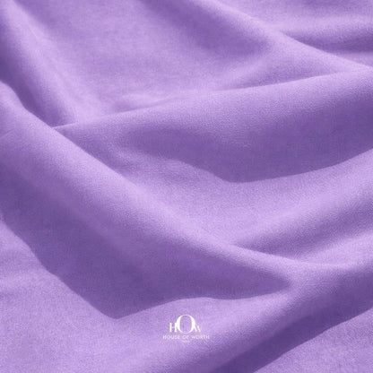 Close-up lilac banana crepe texture, premium heavy crepe fabric for gowns and designer outfits