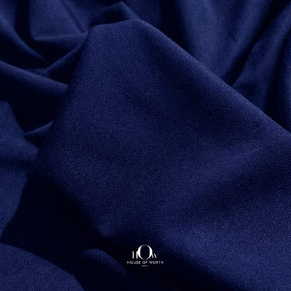 Close-up navy blue banana crepe texture, premium crepe material for blazers and trousers