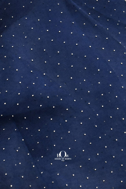 Navy blue organza material with glittering crystal details, luxurious and sheer.