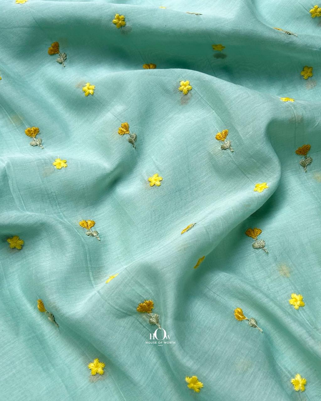 Soft pastel aqua pure mul chanderi fabric with delicate buti motifs.