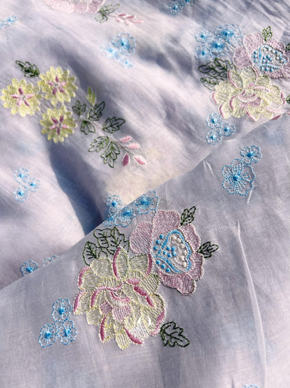 Pure Mul Chanderi fabric in lavender with pastel floral embroidery – perfect for suits, sarees, and occasion wear.