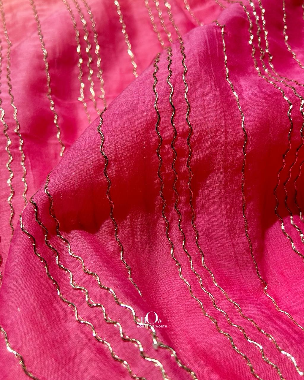 Lightweight sheer Rani Pink chanderi fabric with subtle gold zari highlights – perfect for ethnic wear