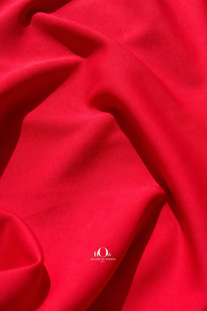 Red imported banana crepe fabric with smooth finish for party wear dresses and gowns
