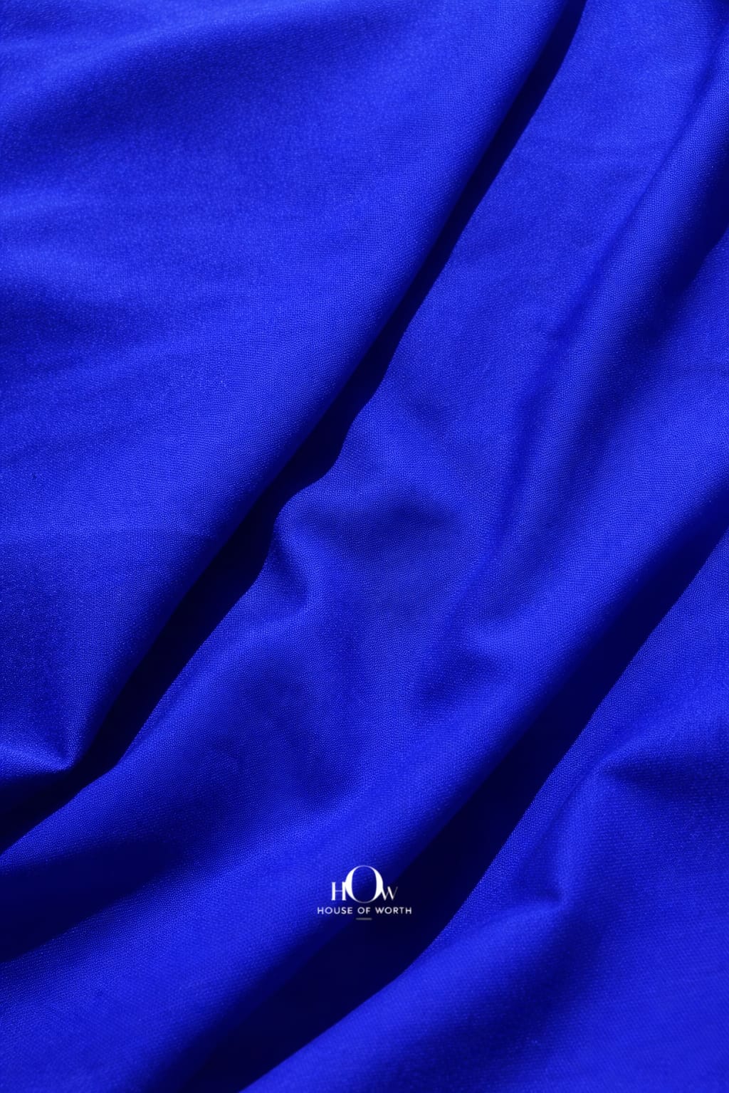 Royal blue imported banana crepe fabric with smooth finish for gowns, skirts and party wear