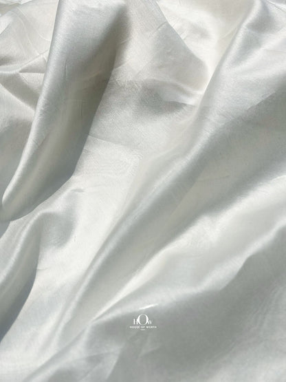 Wholesale 70 gram Mul Chanderi fabric – plain dyeable texture suitable for sarees, salwar suits, and luxury pret collections.