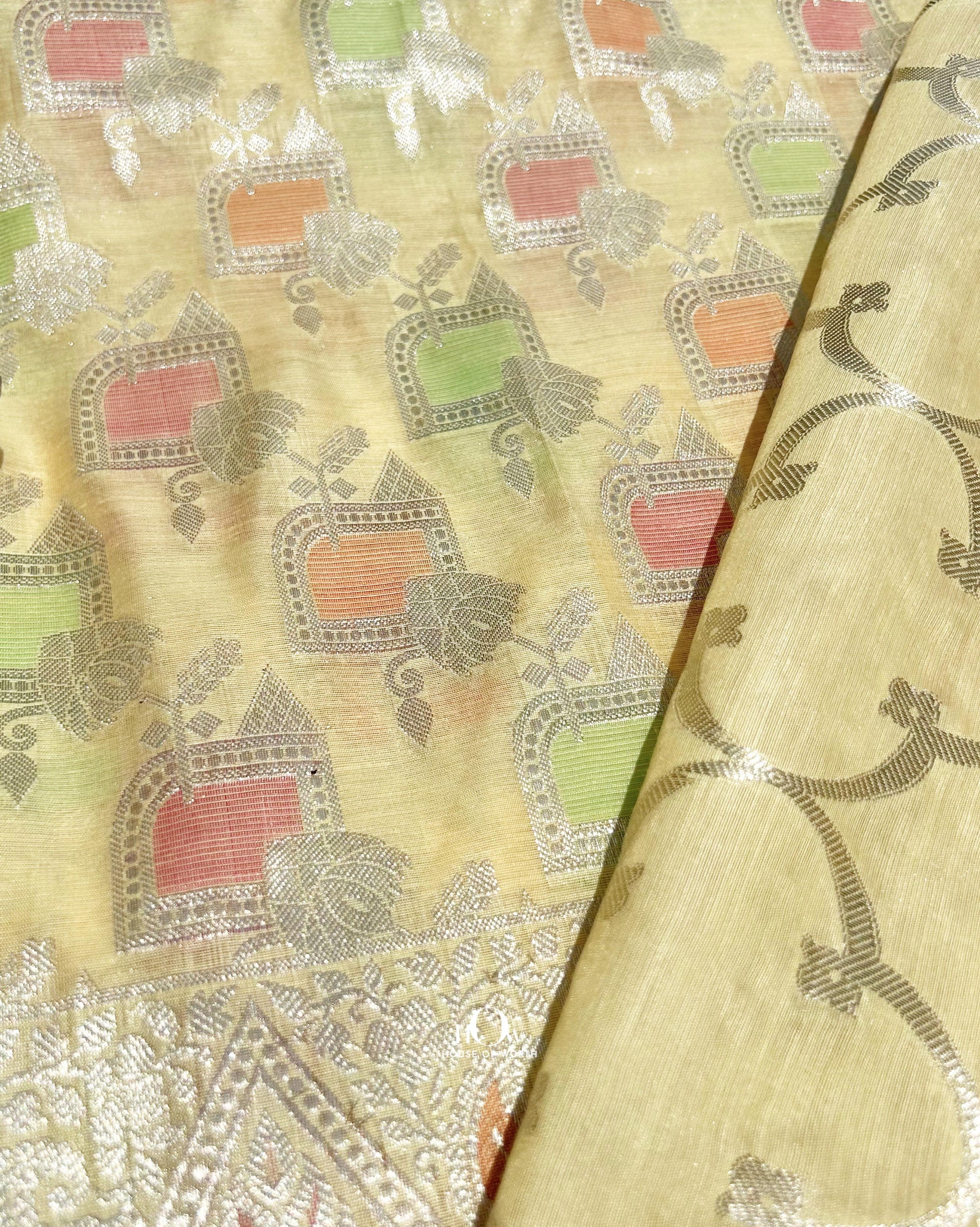 Soft cotton festive suit with multicolour zari and motifs and dupatta.