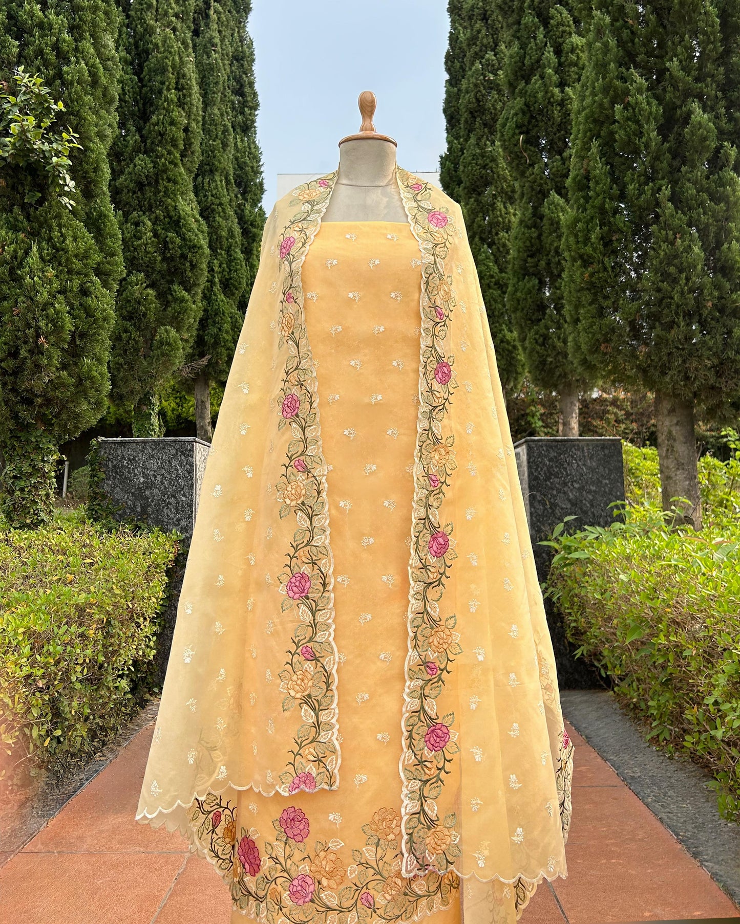 Organza dupatta with floral embroidery on kora silk unstitched suit set.
