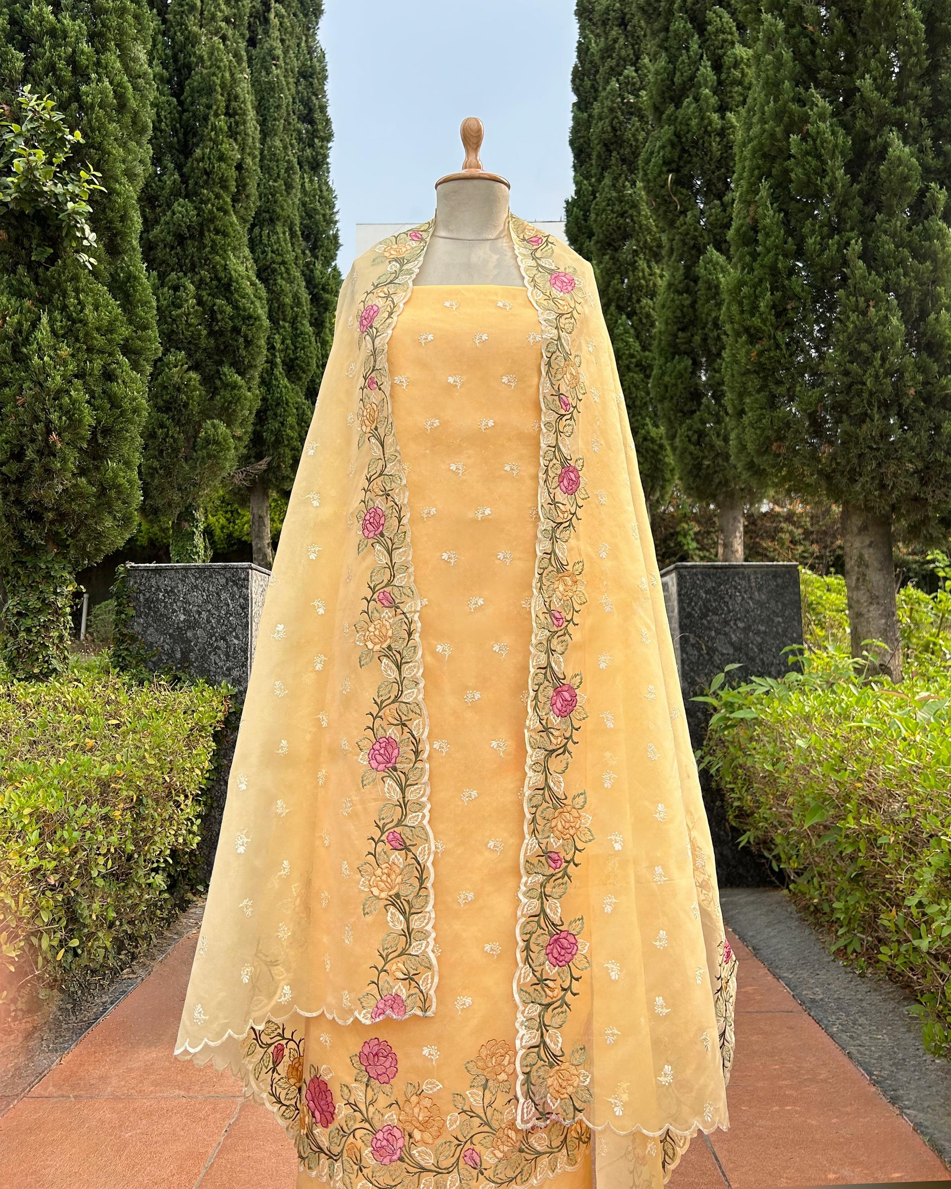 Organza dupatta with floral embroidery on kora silk unstitched suit set.

