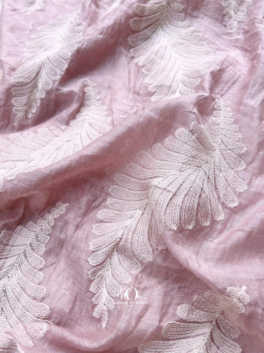 Light pink Pure Mul Chanderi fabric with jacquard leaf motifs – ideal for festive sarees, dupattas, and designer suits.