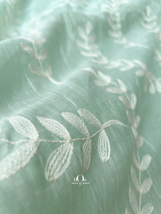 Mint green Mul Chanderi fabric with tonal leaf embroidery – perfect for kurtas, sarees, and summer ethnic sets.