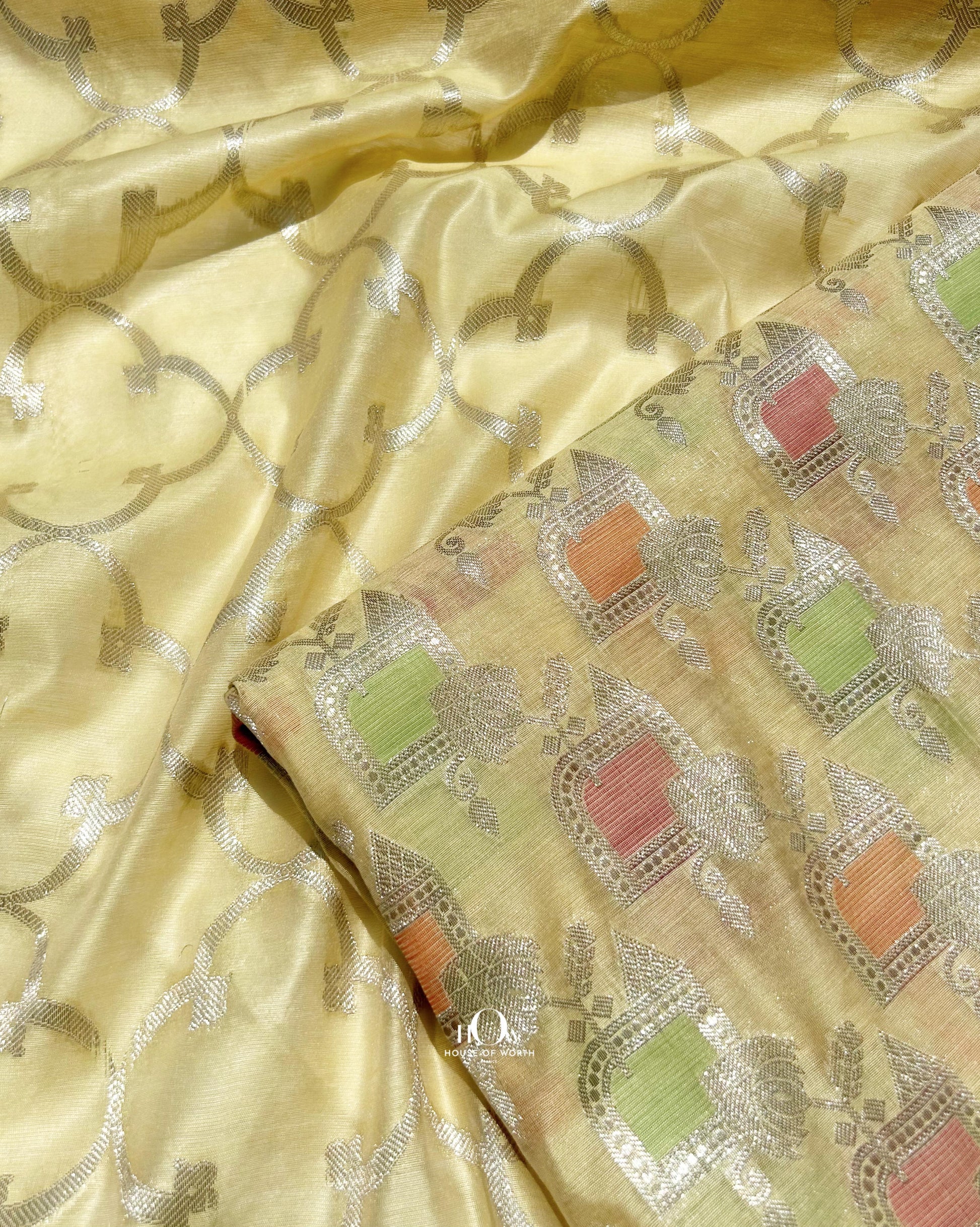 Yellow Banarasi suit with silver zari work design and matching dupatta