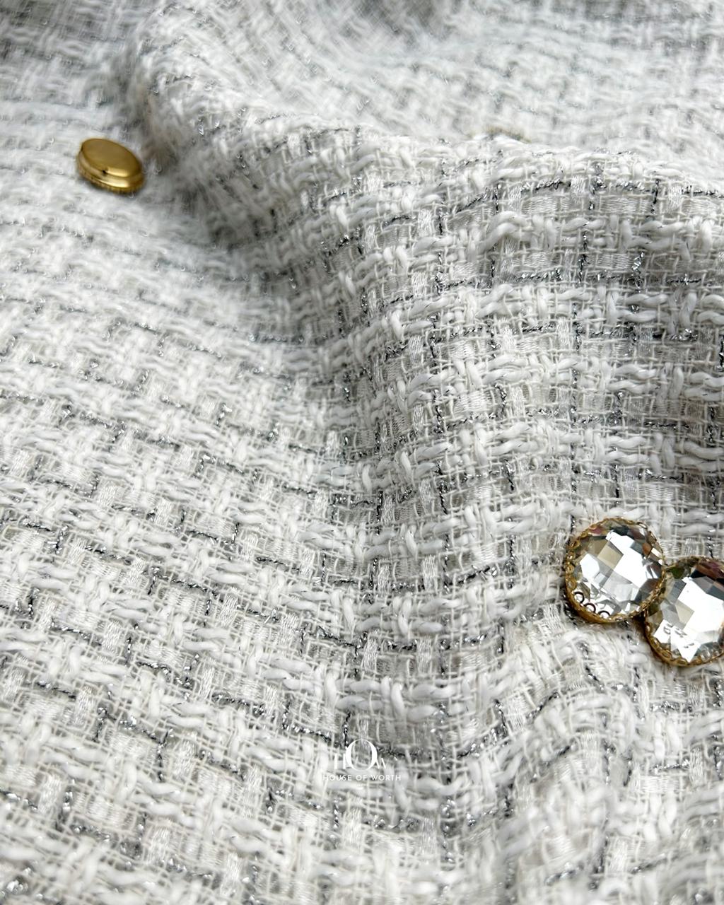 Imported tweed fabric in white colour.