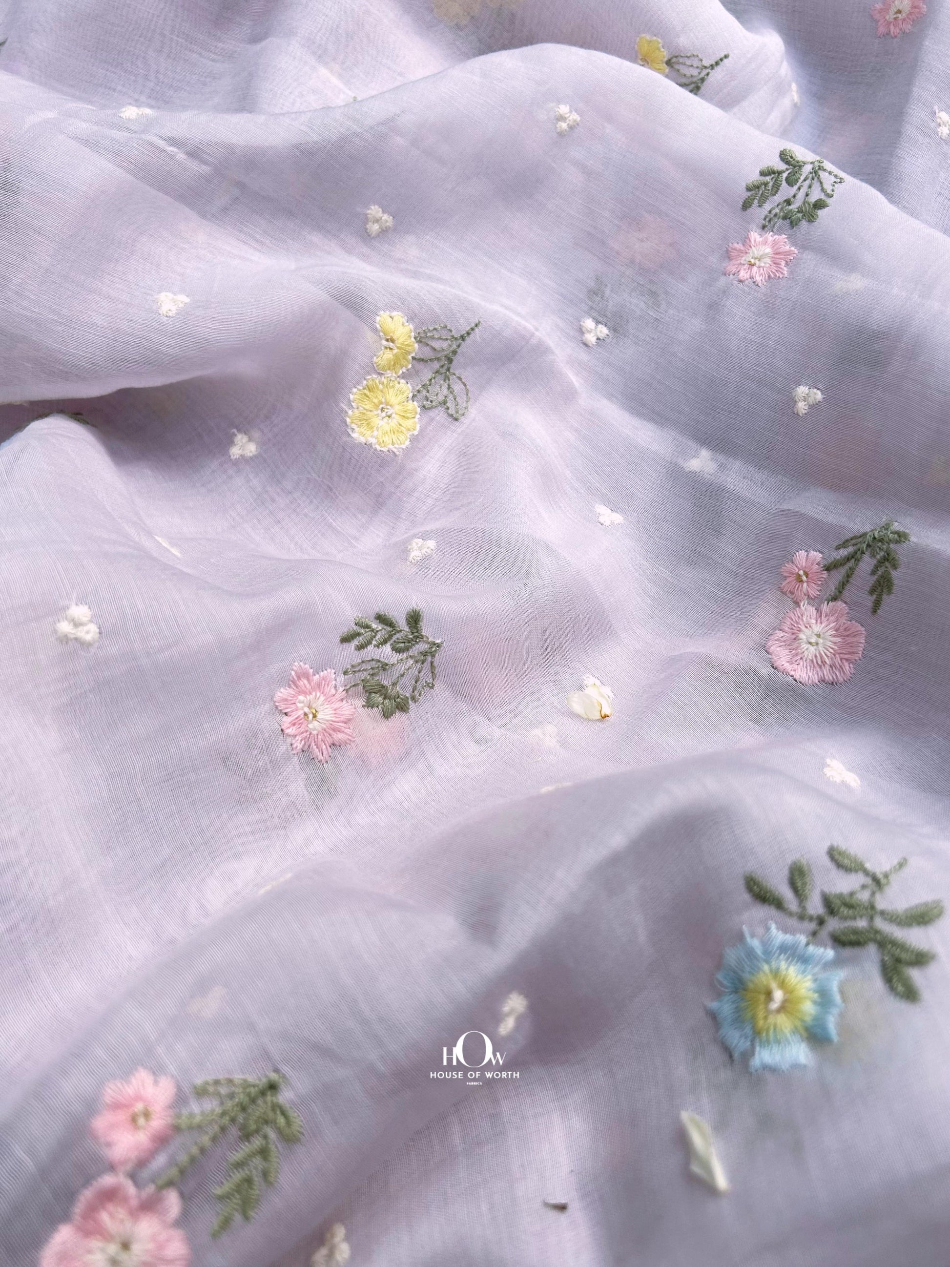 Lavender Pure Mul Chanderi fabric with colorful floral butti embroidery – ideal for kurtis, sarees, and dupattas.