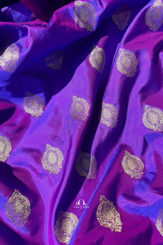 Pure Banarasi silk bridal saree from Varanasi with gold zari work and traditional motifs.