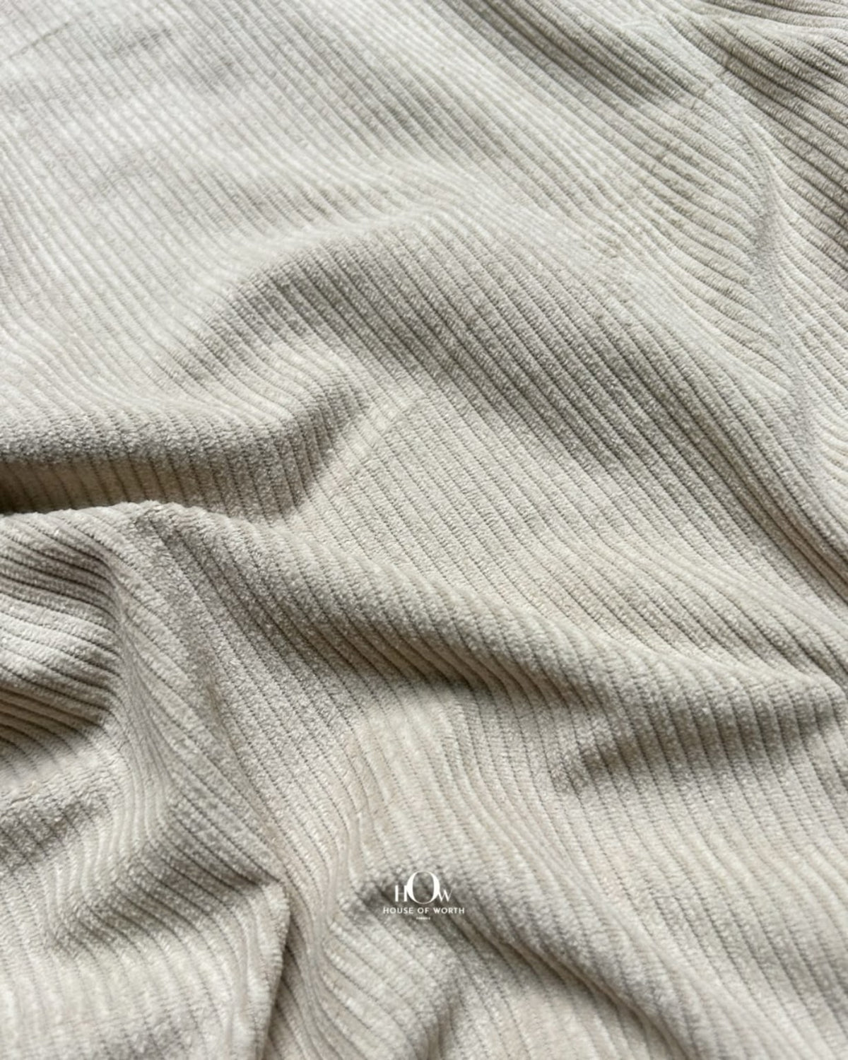 Beige ribbed corduroy in soft folds for skirts, co-ords and modern western wear