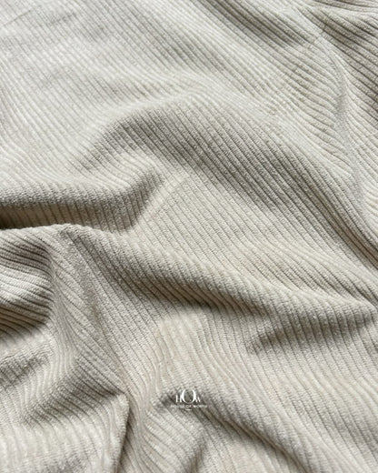 Beige ribbed corduroy in soft folds for skirts, co-ords and modern western wear