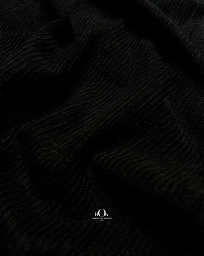 Black ribbed corduroy in folds for skirts, co-ords and contemporary western wear