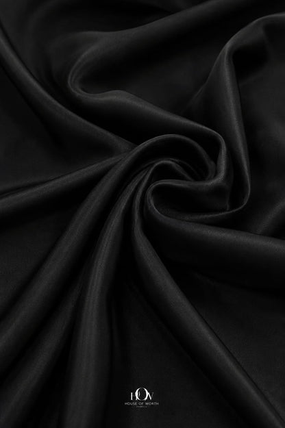 Draped black stretch Lycra fabric with clean fall for polished silhouettes.