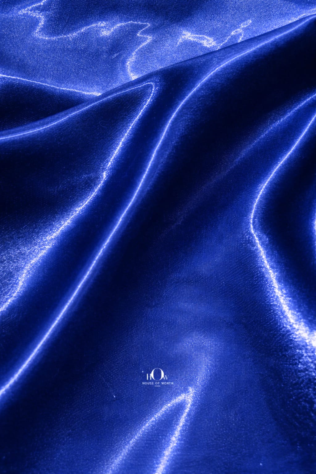 Premium glass satin fabric in rich blue shade for couture wear