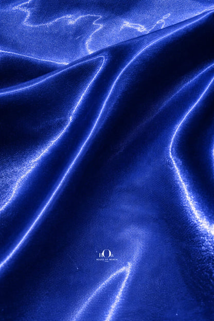 Premium glass satin fabric in rich blue shade for couture wear