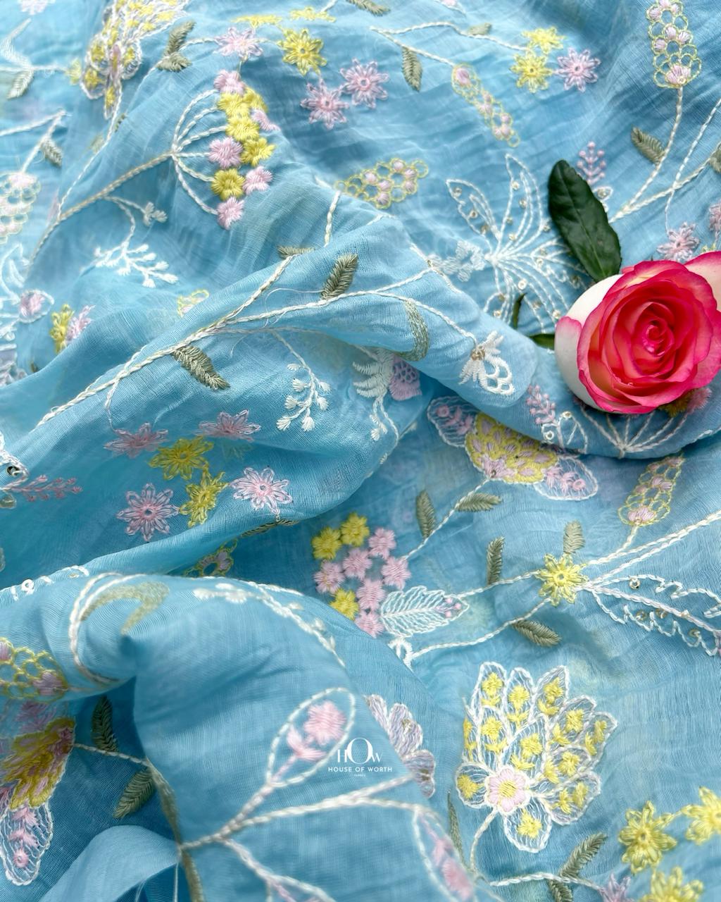 Handloom blue Chanderi mul fabric featuring intricate floral motifs and silk-cotton blend