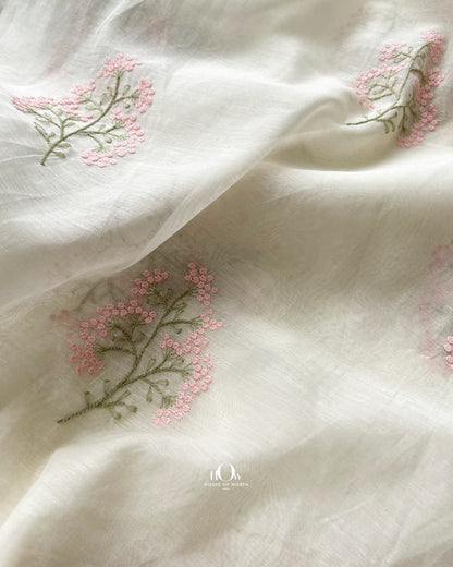 Blush pink and sage botanical embroidery shown in close-up on refined Mul Chanderi