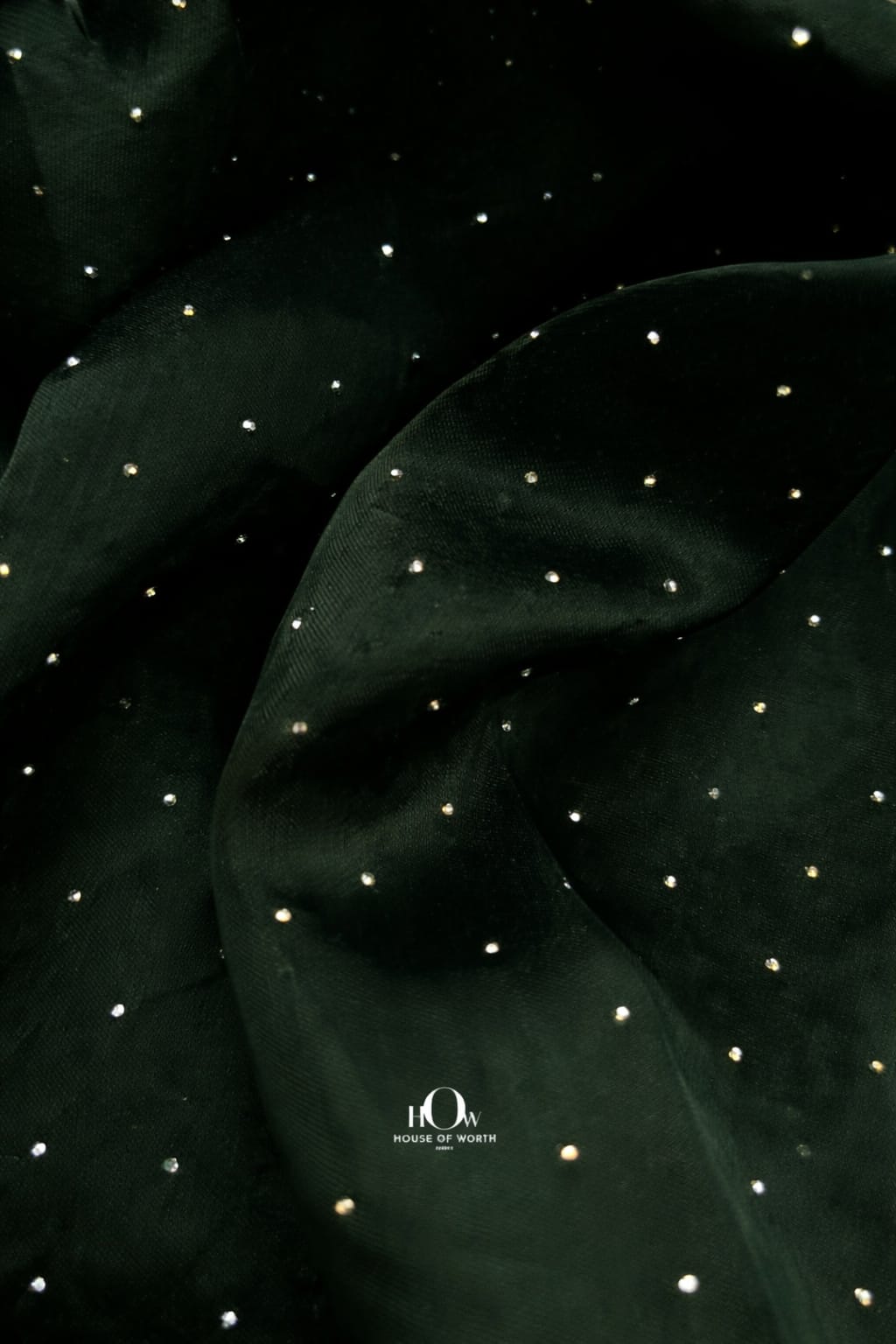 dark green organza material with glittering crystal accents