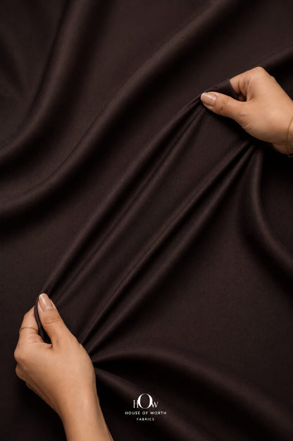 Brown 4 way Lycra fabric displaying multidirectional stretch for easy movement.