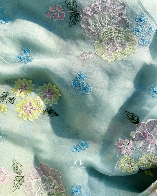 Pure Mul Chanderi fabric in light green with multicolor floral embroidery – perfect for festive suits and saree.