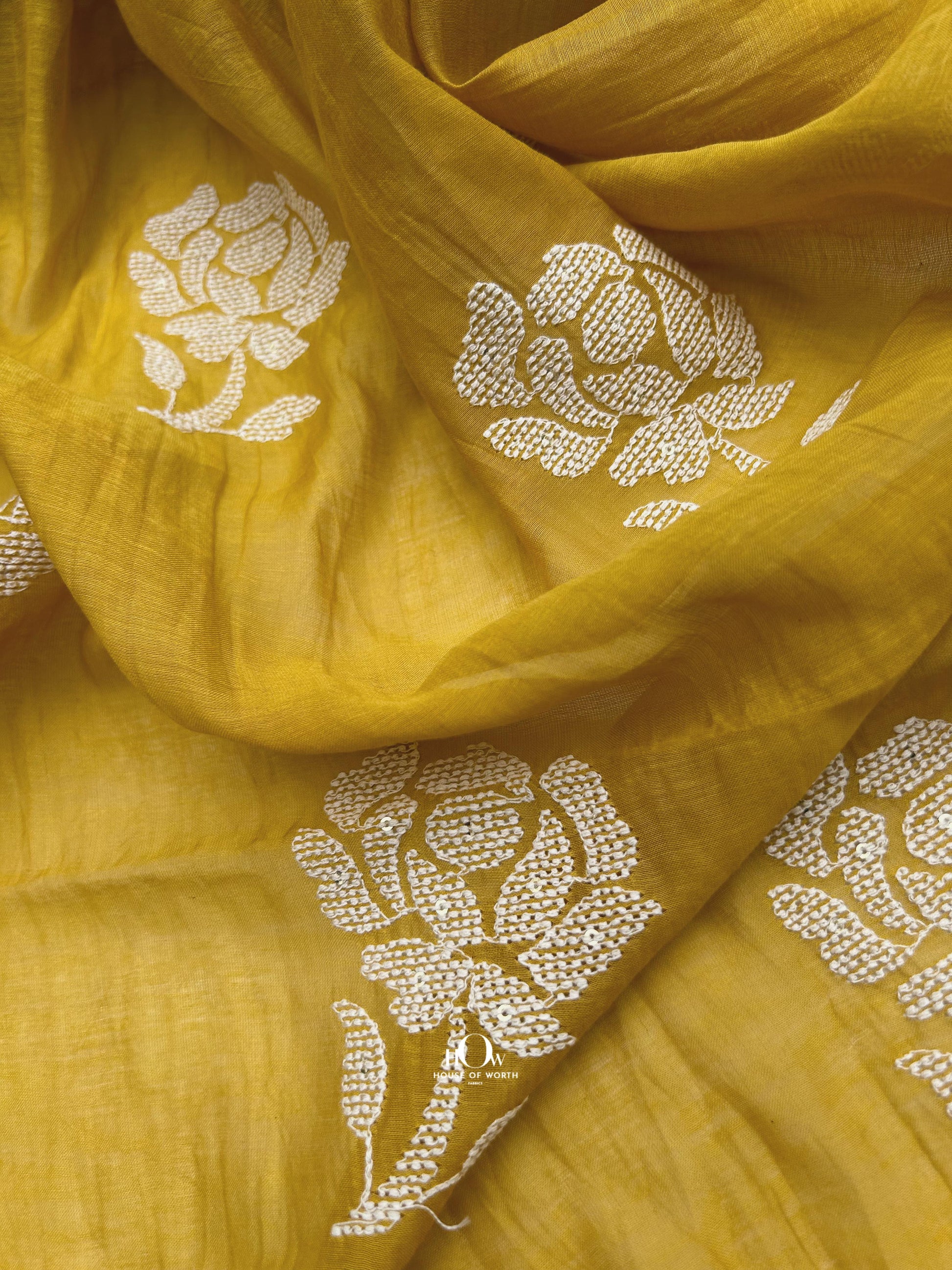 Premium Mul Chanderi dress material with contrast white floral work – vibrant option for salwar suits and ethnic collections.