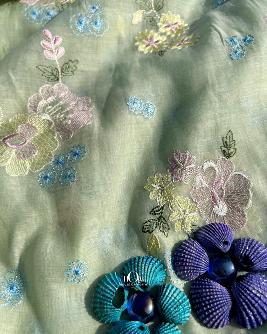 Pistachio green Pure Mul Chanderi fabric with multicolor thread embroidery – elegant and versatile for suits and sarees.