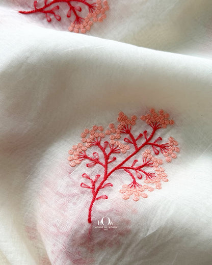 Close detail of coral floral embroidery and red stem work on Pure Mul Chanderi