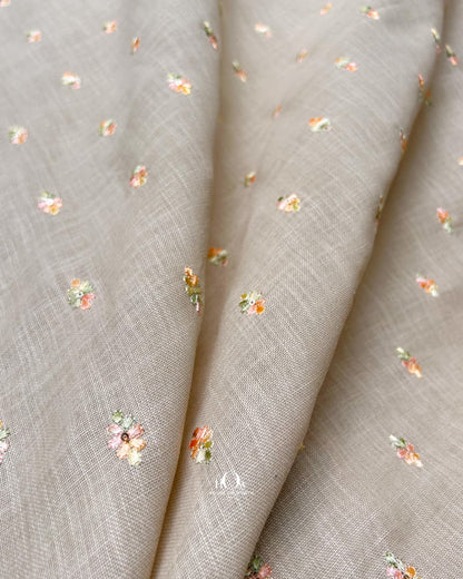Taupe beige cotton linen fabric with delicate floral embroidery for boutique ethnic designs.