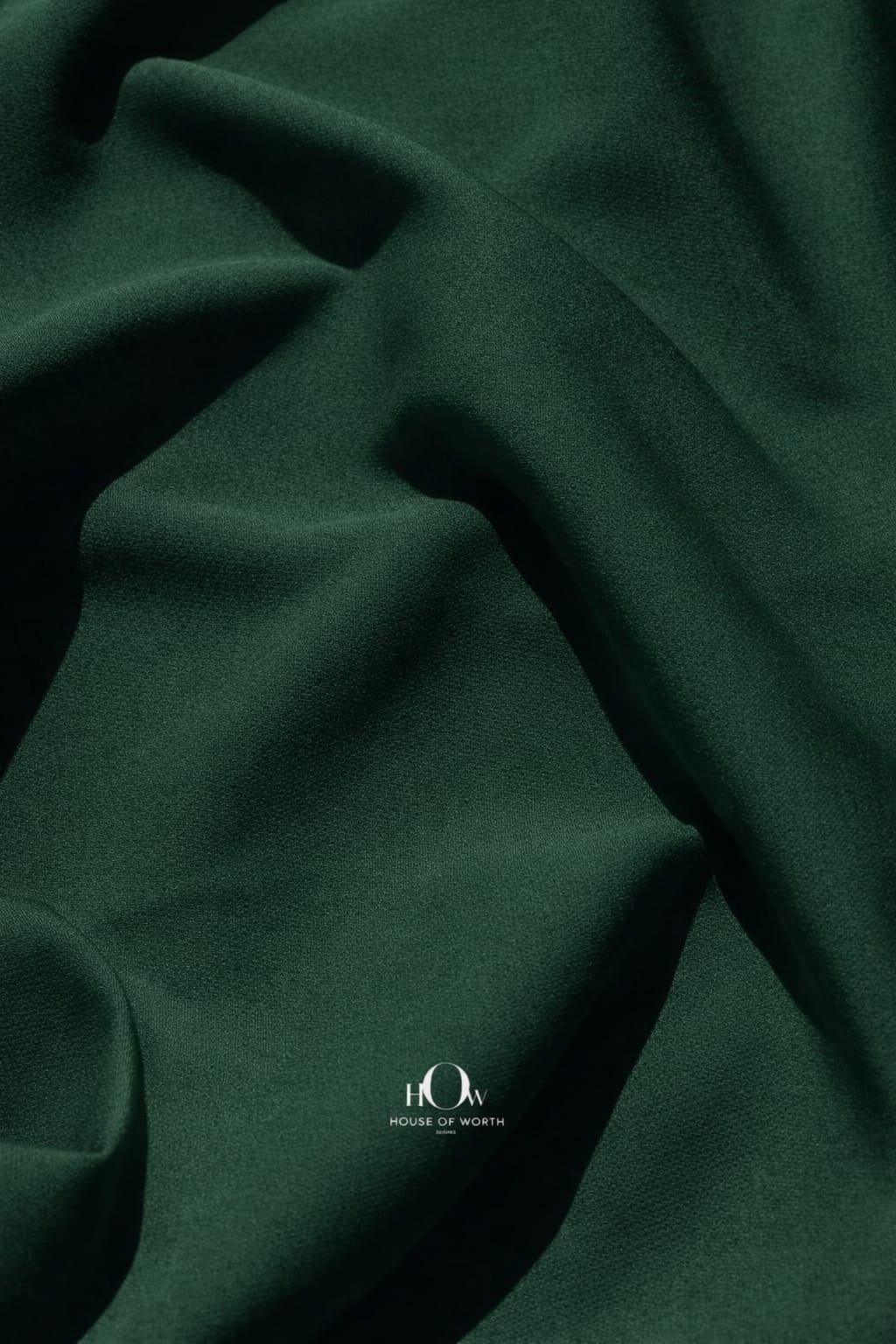 Dark bottle green imported banana crepe fabric, smooth finish for gowns and party wear