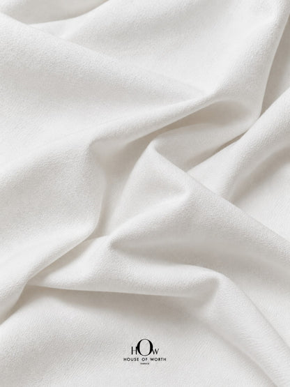 White denim fabric with clean folds for jeans, jackets, trousers, skirts and western wear