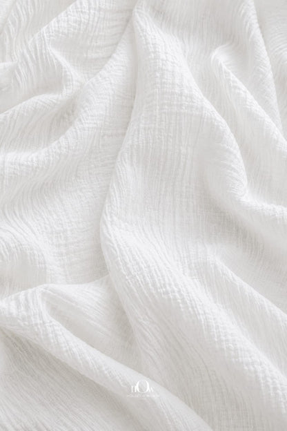 Pure crinkle cotton fabric highlighting its natural textured weave; dyeable soft cotton cloth