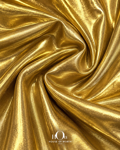 Close view of golden metallic Disco Lycra fabric for partywear, stagewear and costumes