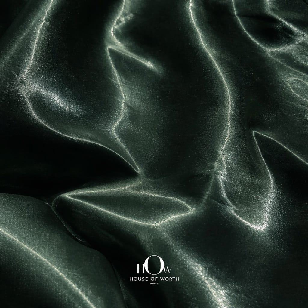 Premium glass satin fabric in deep green shade for designer wear