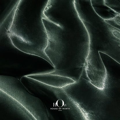 Premium glass satin fabric in deep green shade for designer wear