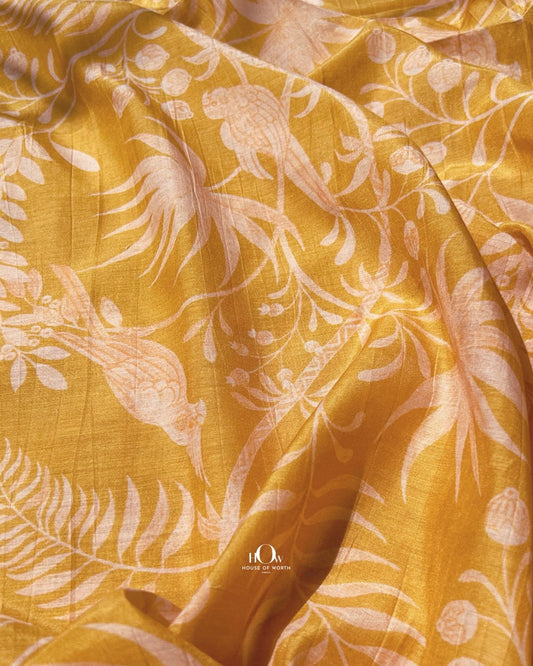 Yellow printed Mul Chanderi fabric with leaf design – soft handloom fabric for ethnic suits and sarees.