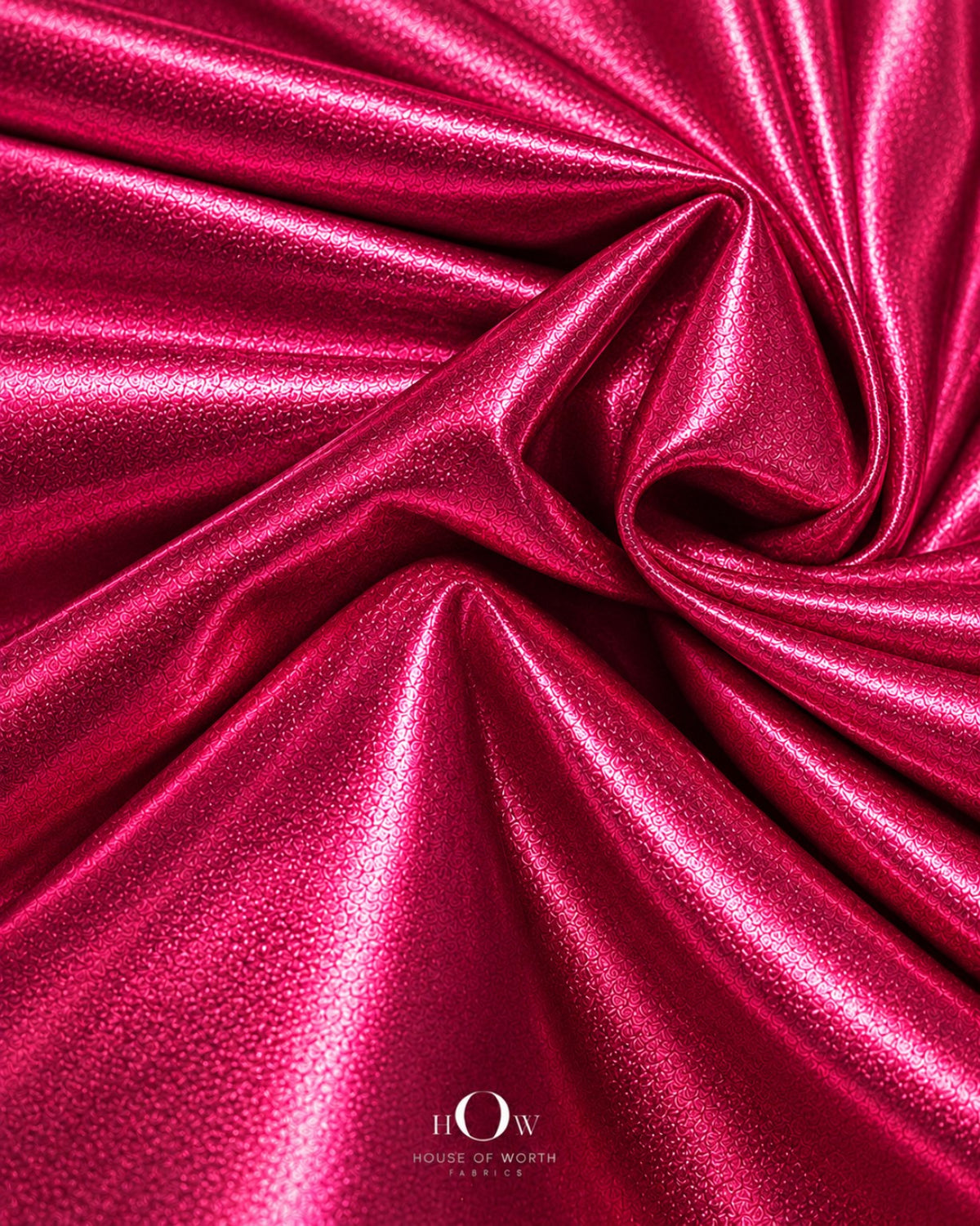 Hot pink shiny metallic Lycra fabric drape for dresses, stagewear and statement fashion