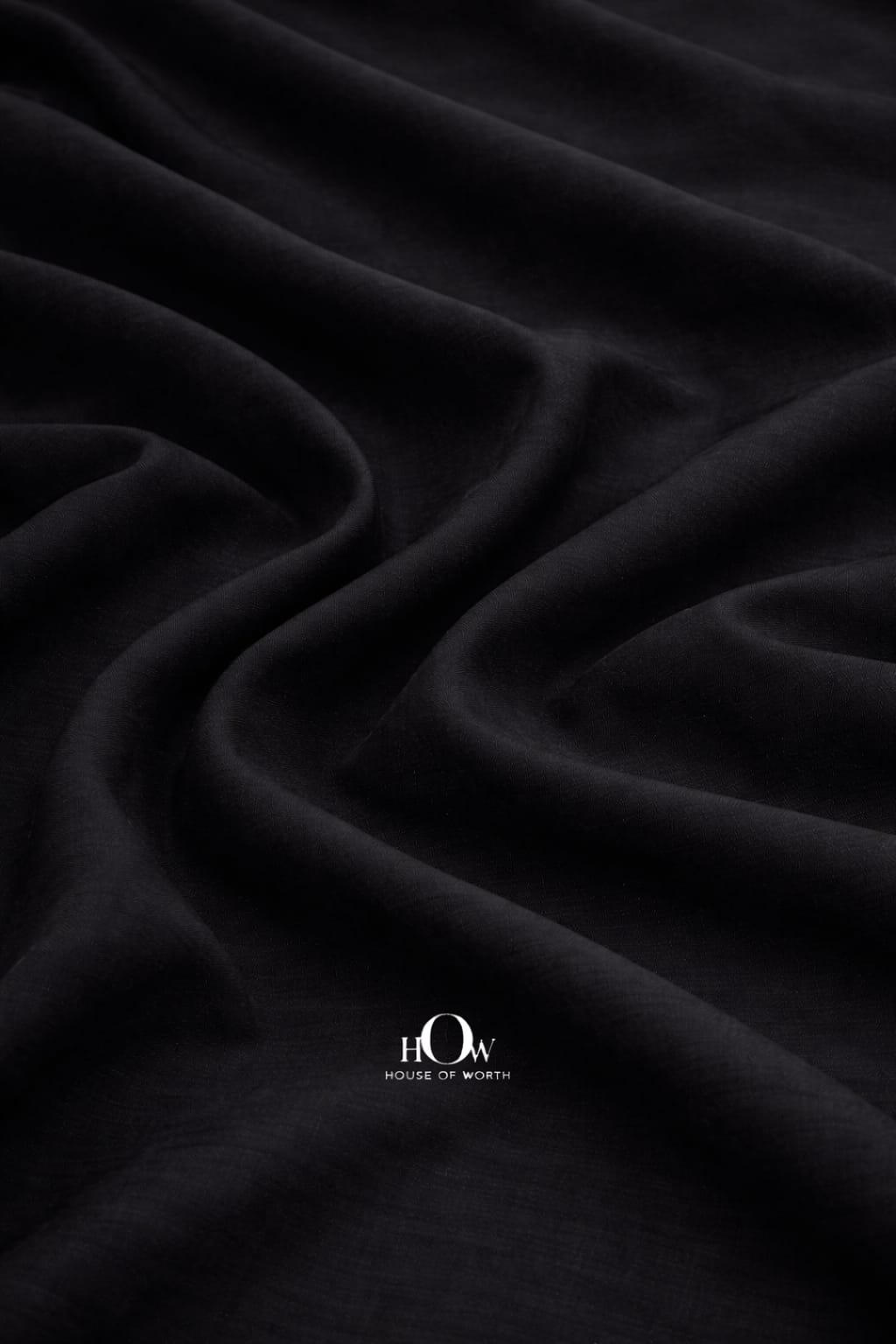 High-quality black cotton poplin fabric for tailored garments and dresses
